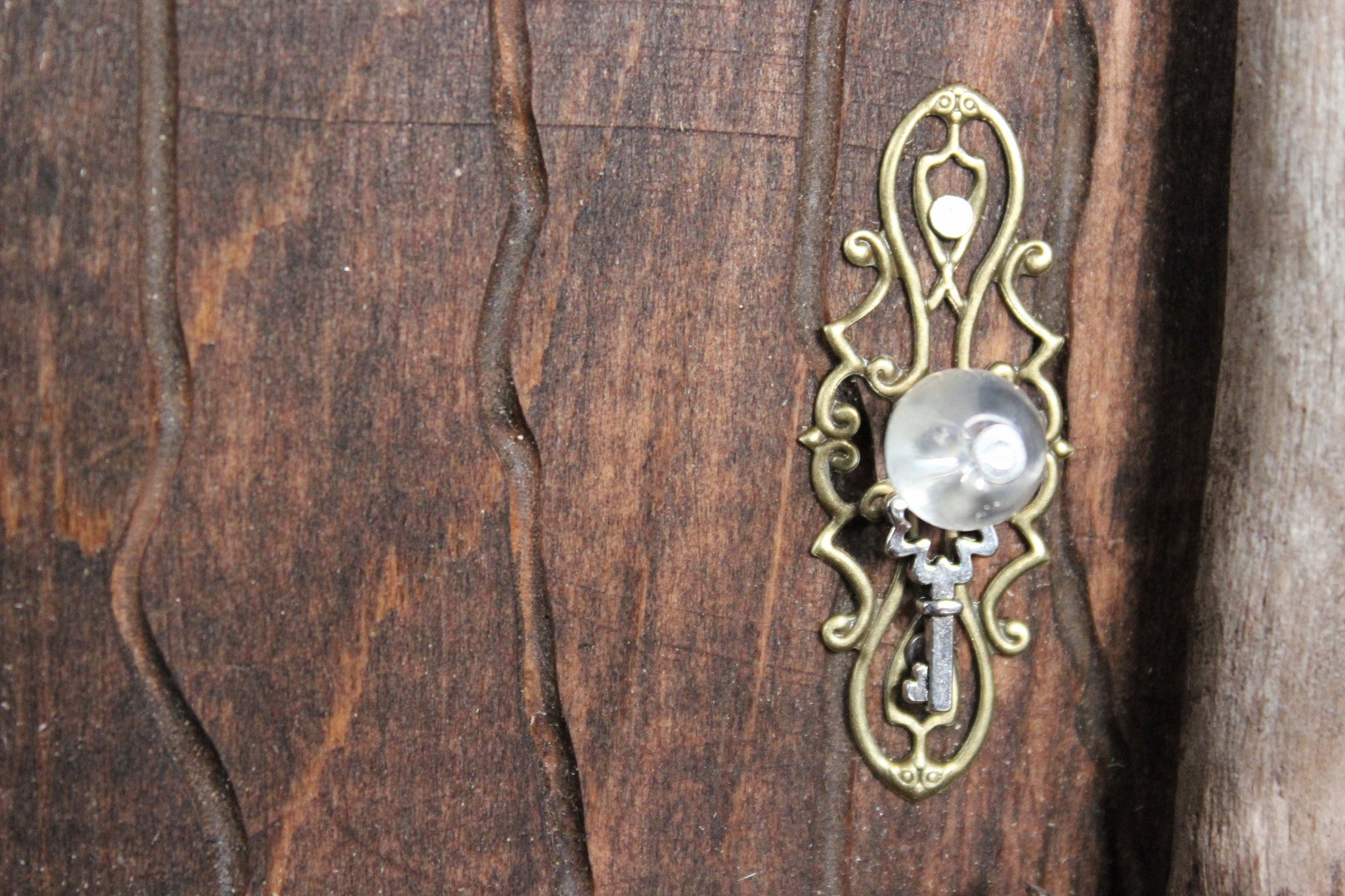 brown fairy door, doorknob, glass bead